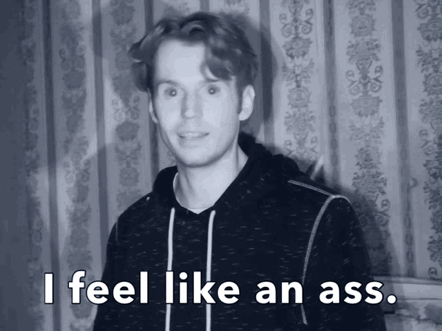 a black and white photo of a man with the words i feel like an ass below him