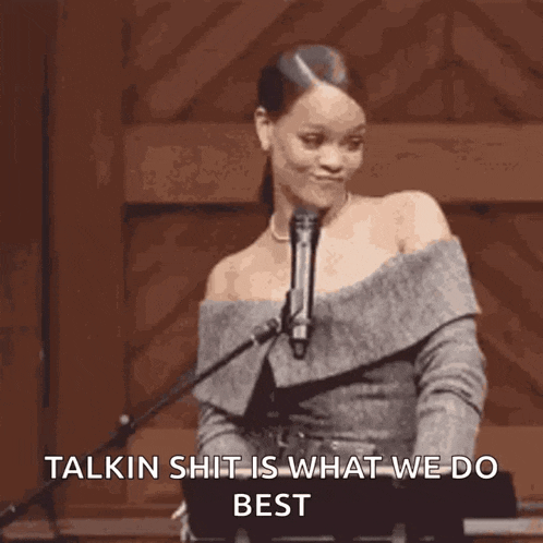 a woman standing in front of a microphone with the words talkin shit is what we do best written below her