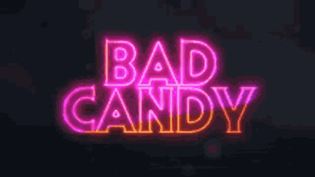 a neon sign that says bad candy on a dark background