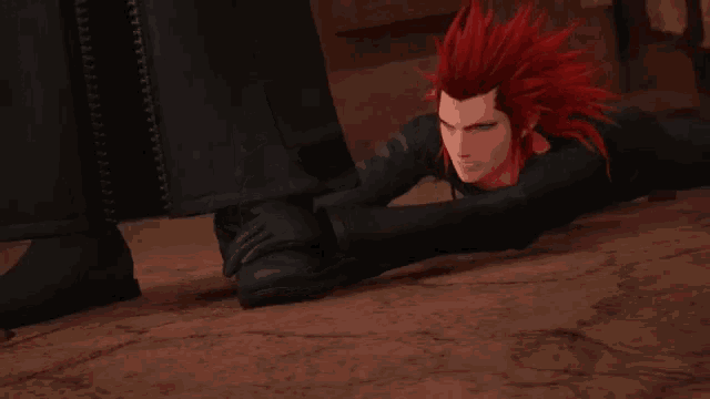 a cartoon character with red hair is laying down on the ground
