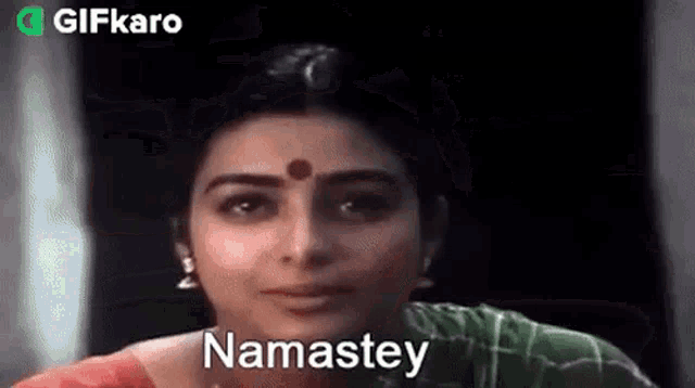 a close up of a woman 's face with the word namastey on it .