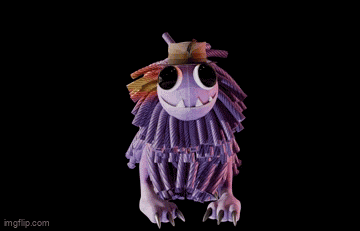 a purple monster is wearing a top hat
