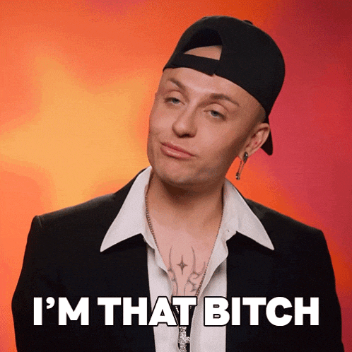 a man wearing a baseball cap and a suit says i 'm that bitch