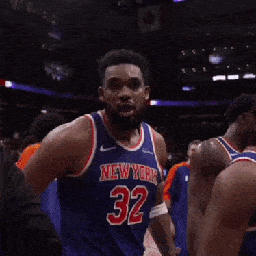 a basketball player for the new york knicks is giving the middle finger .