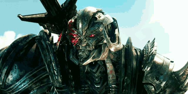 a close up of a robot with red eyes and horns