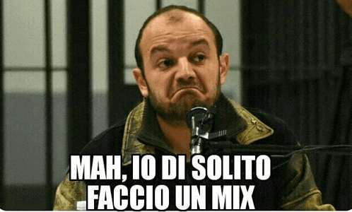 a man with a beard behind a microphone with mah io di solito faccio un mix written below him