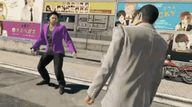 a man in a purple jacket is standing next to another man in a white jacket