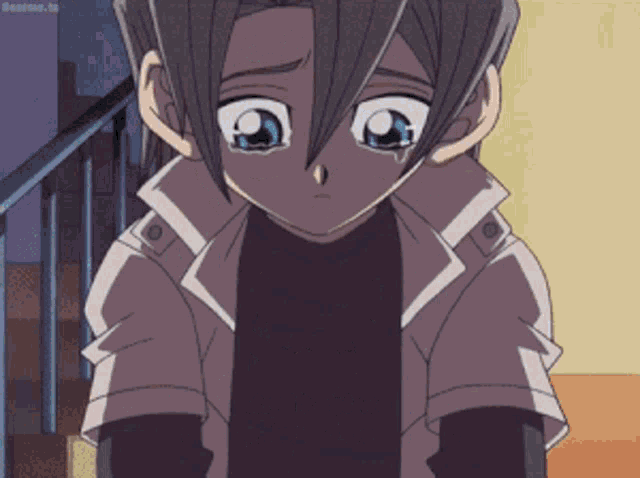 a boy is crying in a cartoon with the word anime in the corner