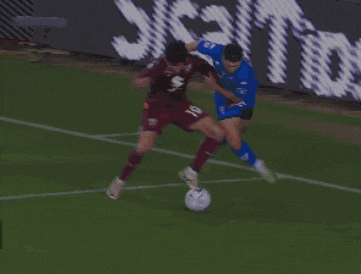 a soccer player wearing a number 6 jersey is playing against a player wearing a number 19 jersey