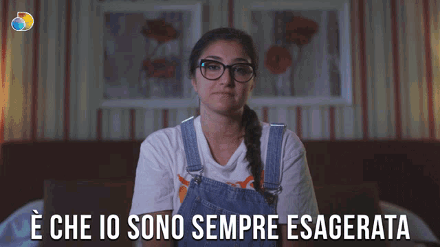 a woman wearing overalls and glasses says e che io sono sempre esagerata