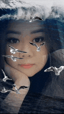 a woman with birds flying around her face