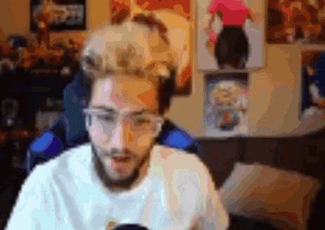 a blurry picture of a man with a beard and glasses