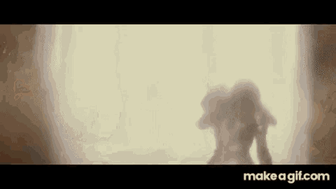a silhouette of a person standing in front of a window in a room .