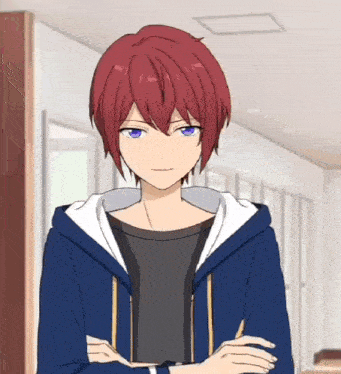 a man with red hair and blue eyes is wearing a blue hoodie