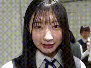 a close up of a girl wearing a white shirt and tie .