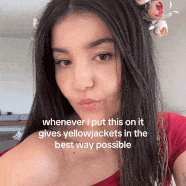 a woman with flowers in her hair has a caption that says whenever i put this on it gives yellowjackets in the best way possible