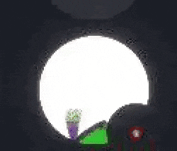 a green cartoon character is sitting in a circle with a red circle with a number 2 on it .