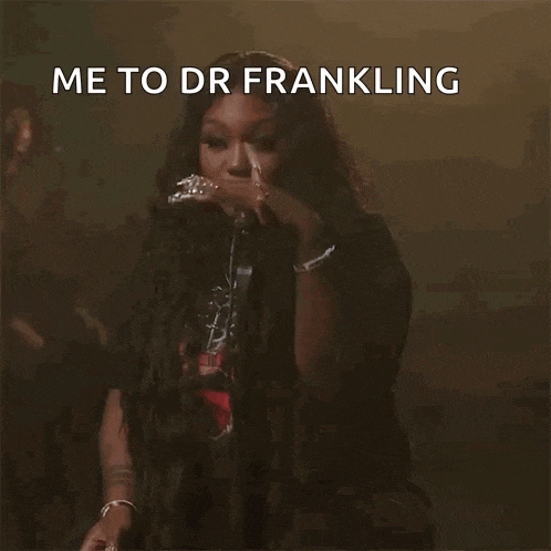 a woman singing into a microphone with the caption " me to dr frankling what 's under there ? "