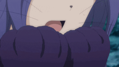 a close up of a person 's face with a purple sweater