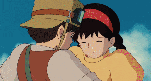 a boy and a girl are hugging with the girl wearing goggles on her head