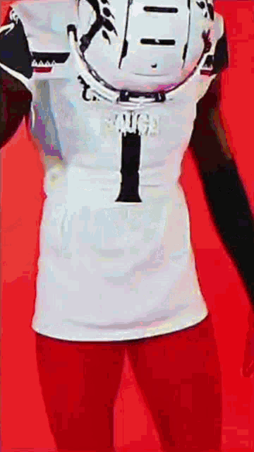 a football player wearing a white jersey with the number 1 on the back
