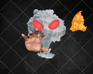 a person 's hand is reaching out towards a cloud of smoke and fire