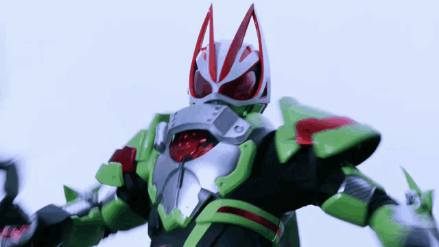 a green and silver superhero with red eyes and ears