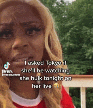 a woman is crying while talking on a cell phone and asking tokyo if she 'll be watching she hulk tonight