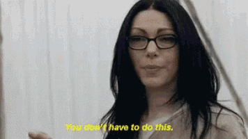 a woman wearing glasses is saying `` you don t have to do this '' .
