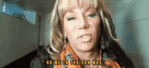 a woman says " no me la traigan mas " while wearing a scarf