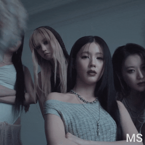 a group of women standing next to each other with the letters ms above them
