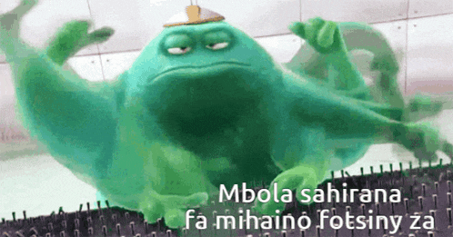 a green monster with the words mbola sahirana fa mihaino fotsiny za