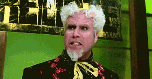a man with white hair and a beard has a yellow tie around his neck