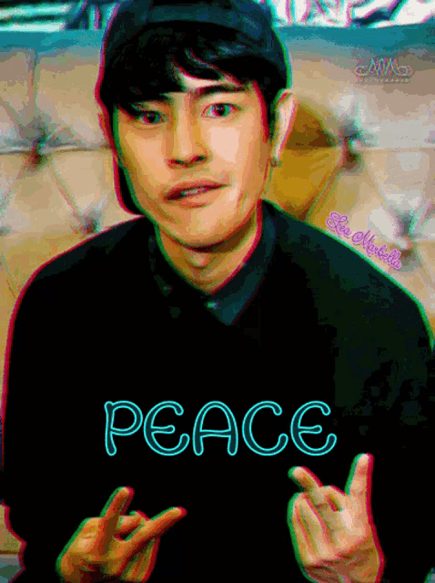a man wearing a peace sweater giving the middle finger