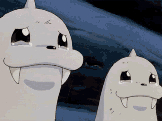 two cartoon seals are crying and one has a toothy smile on its face