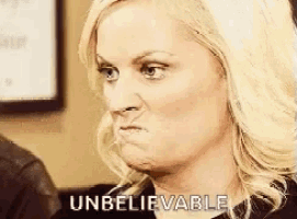 a woman is making a funny face and the words `` unbelievable '' are visible .