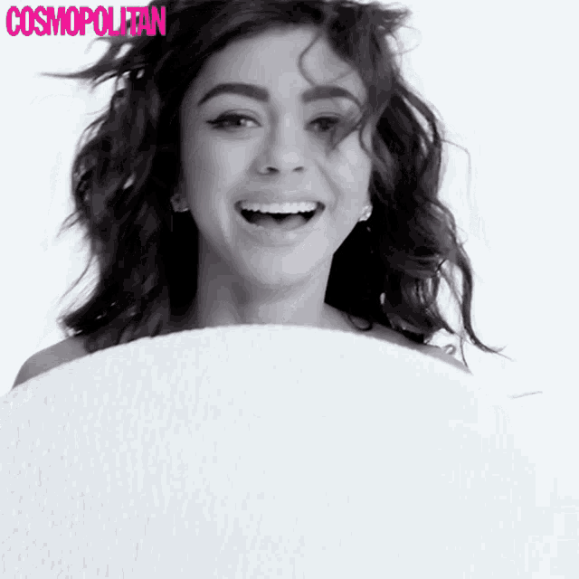 a black and white photo of a woman with cosmopolitan written on the bottom right