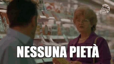 a man and a woman are talking in a store and the woman is holding a piece of paper that says nessuna pieta