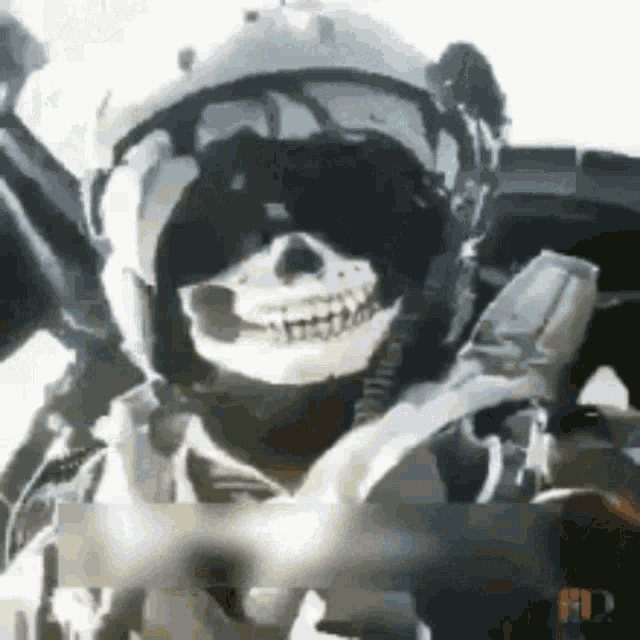 a soldier wearing a skull mask and a helmet .