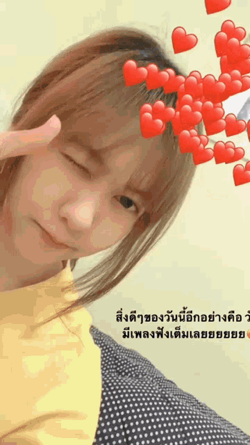 a girl with red hearts on her head and a yellow shirt on