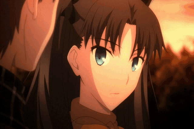 a close up of a girl with blue eyes looking at the camera