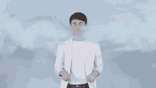 a young man is making a funny face with his eyes closed