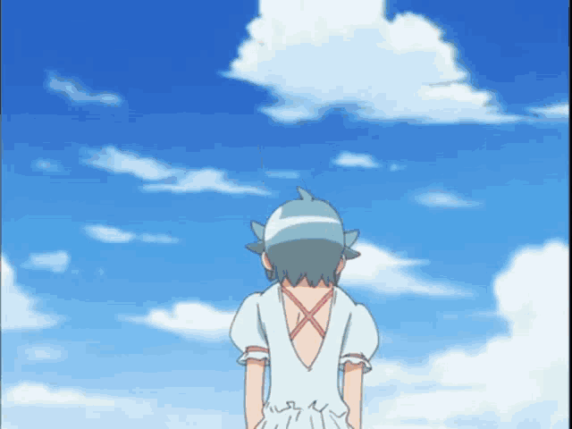 a girl in a white dress is standing in front of a blue sky with white clouds