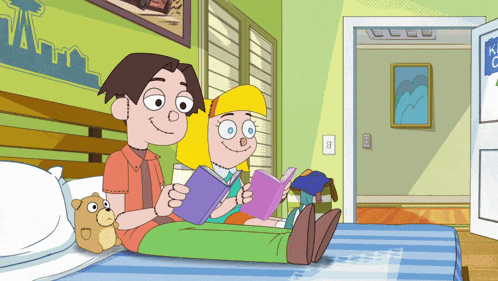 a boy and a girl are sitting on a bed reading books