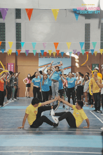 a group of people are dancing in front of a sign that says " what a wonderful day "
