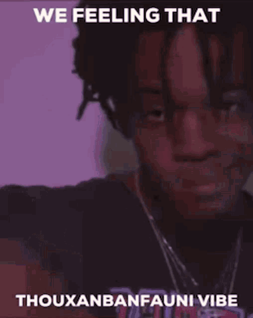 a man with dreadlocks is taking a selfie with a caption that says `` we feeling that thouxanbanfauni vibe ''
