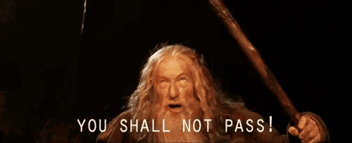 a blurred image of a man with a beard and the words you shall not pass