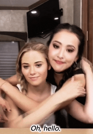 two women hugging each other with the words oh hello written below them