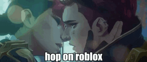 a man and a woman are kissing with the words `` hop on roblox '' written above them .