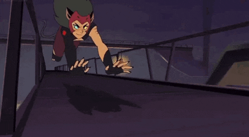 catra from she ra and the princesses of power is crawling on the ground with her paws outstretched .